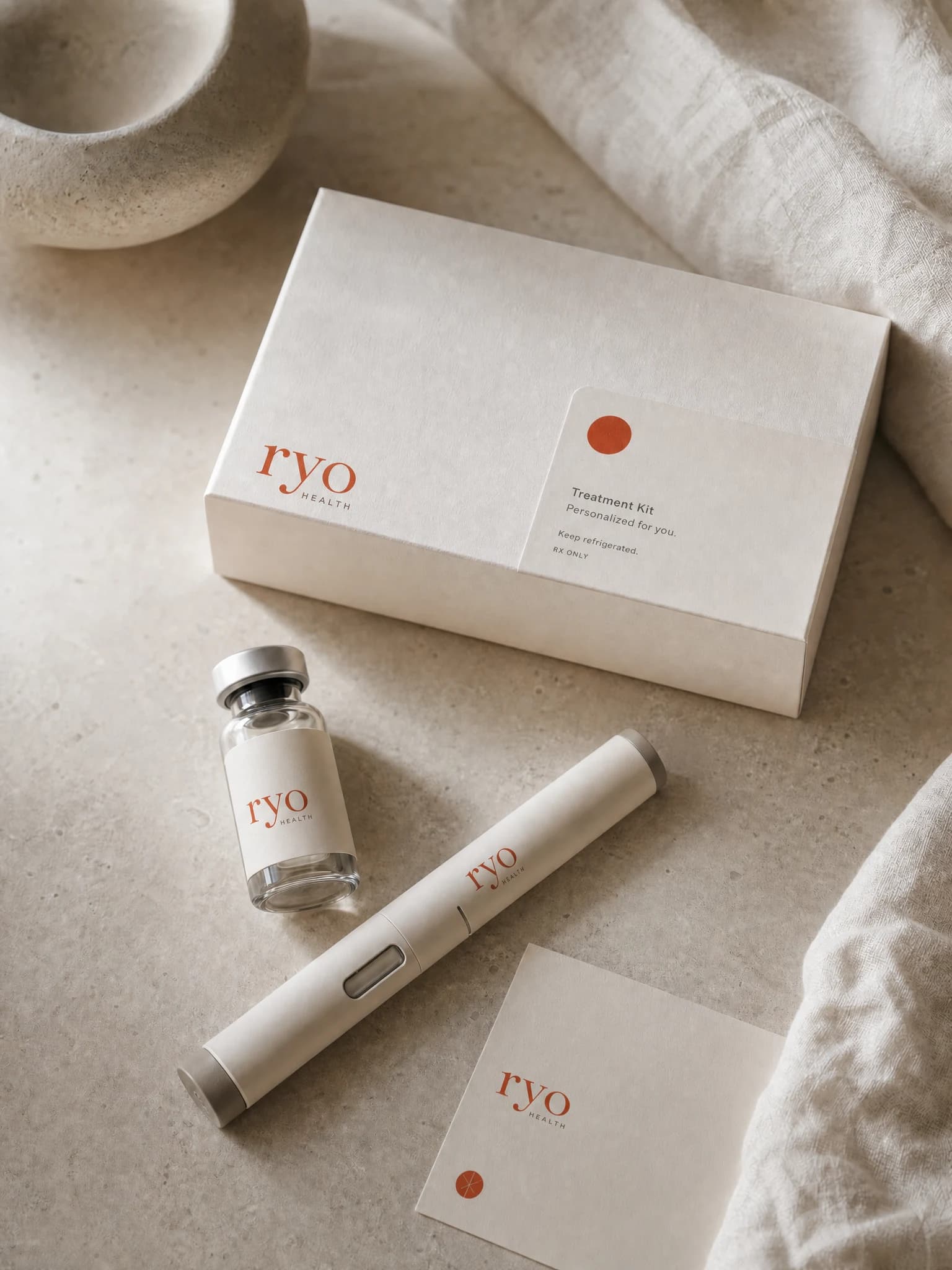 A Ryo treatment kit: a labeled vial, an auto-injector pen, and a personalized card